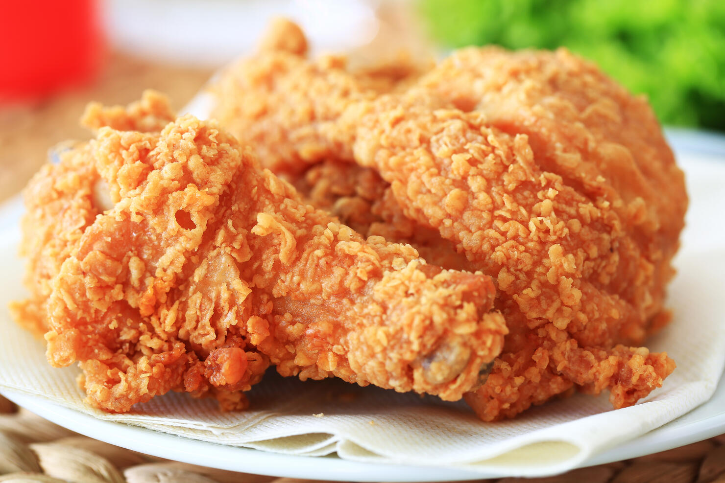 Close-up photo of fried chicken on white plate