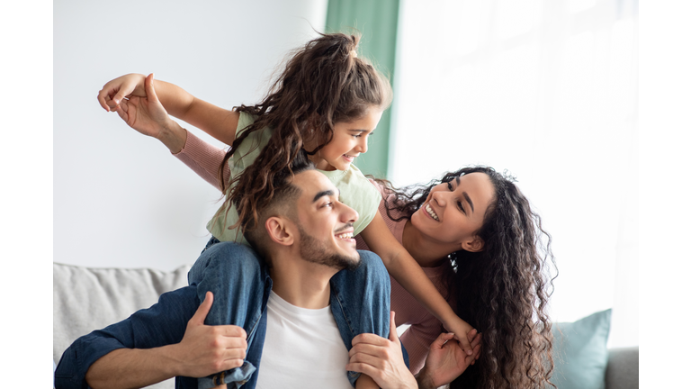 Cheerful Middle Eastern Family Of Three Having Fun Together At Home