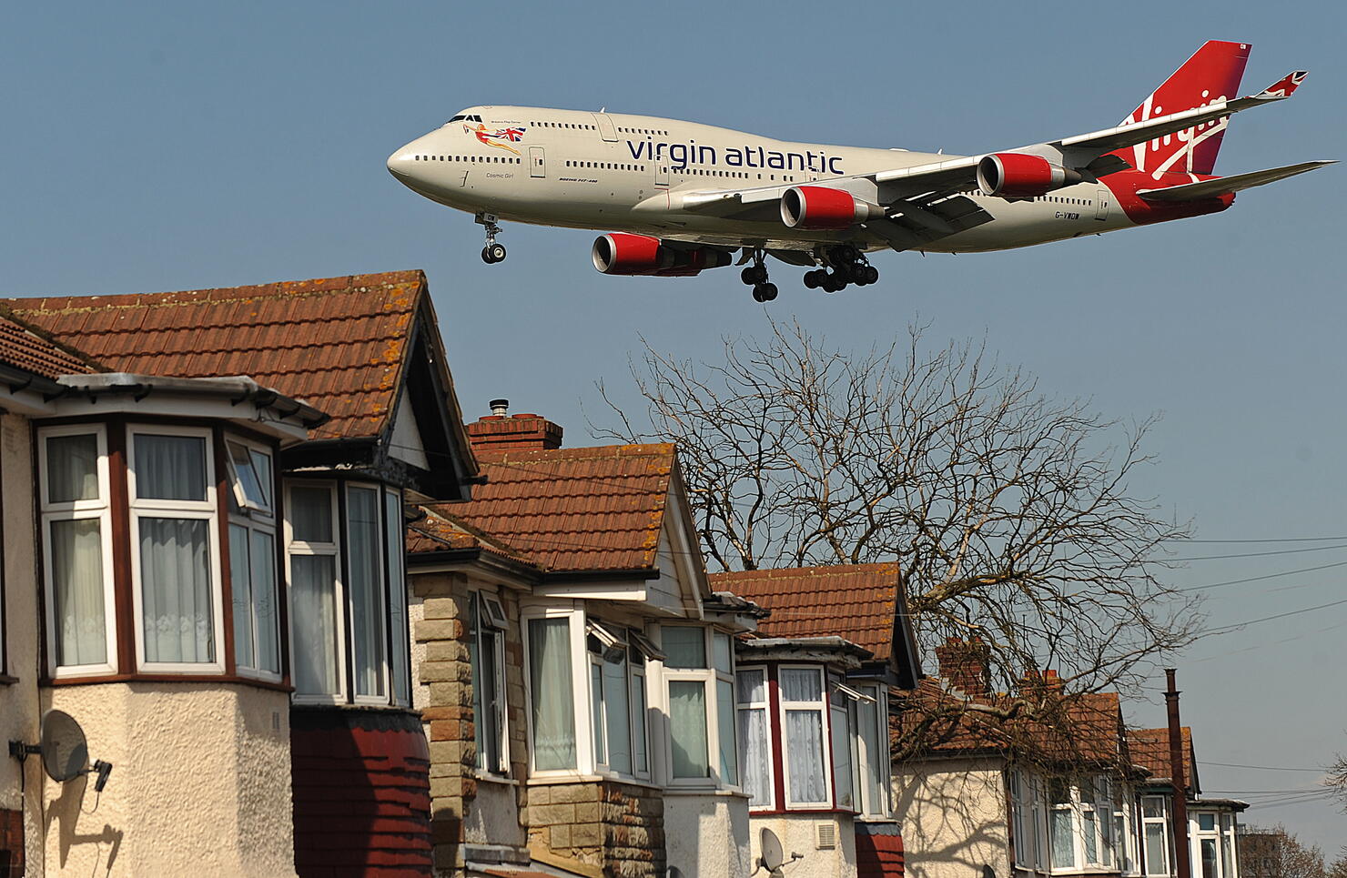 A Virgin Atlantic passenger jet flies ov