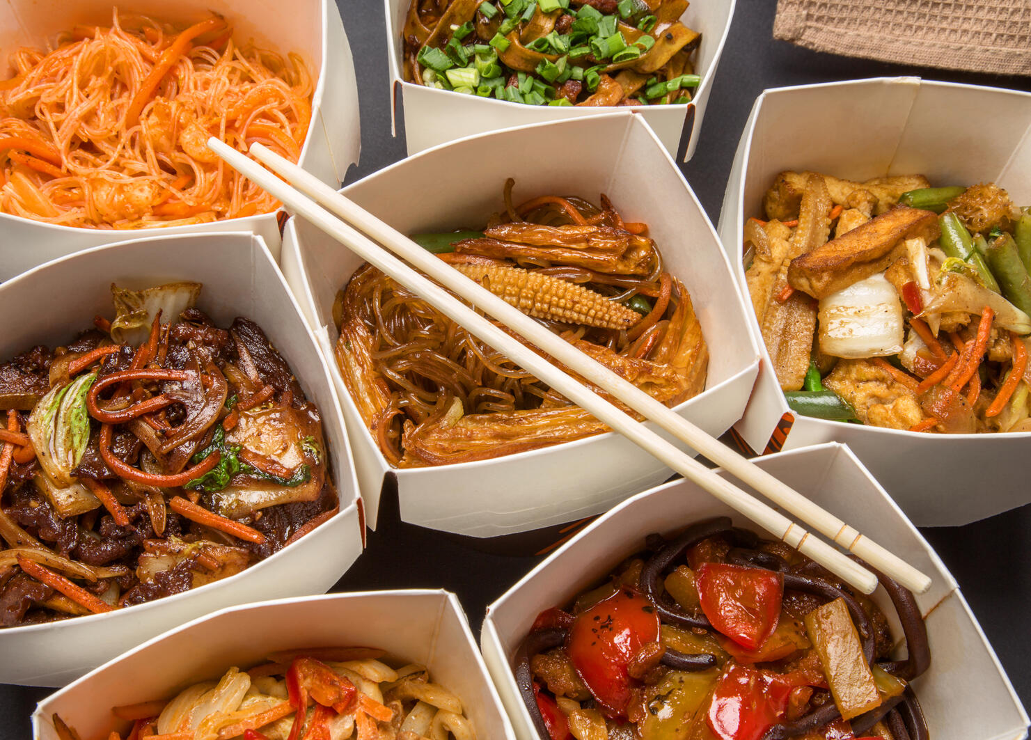 Chinese food in different cardboard boxes