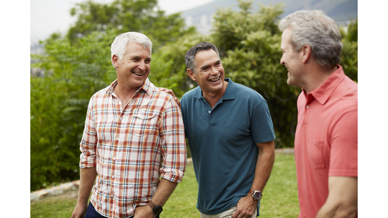 Happy mature friends enjoying in park