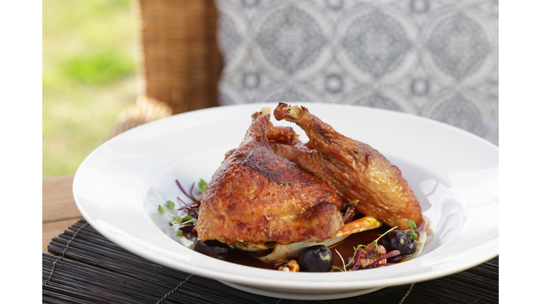 Twice-cooked duck with cherry dressing
