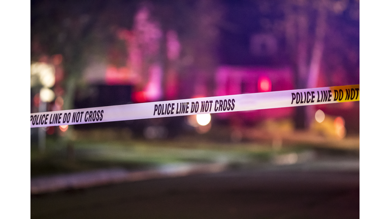 A crime scene is marked off with police tape