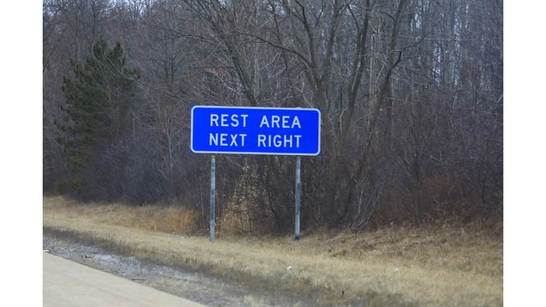 Rest area ahead notification sign off the highway