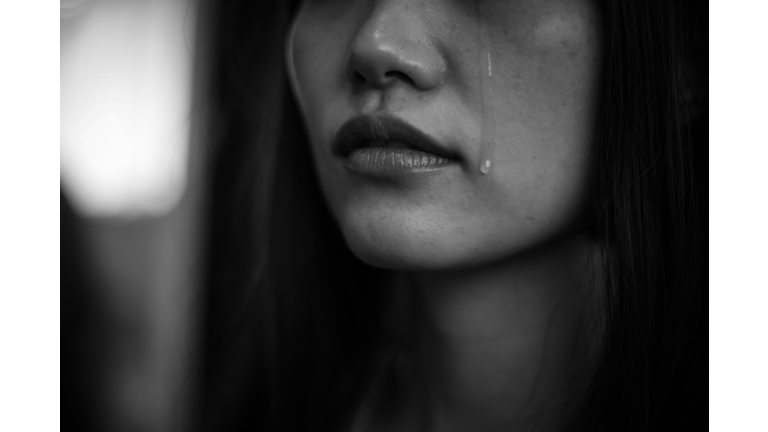 Woman shedding tears