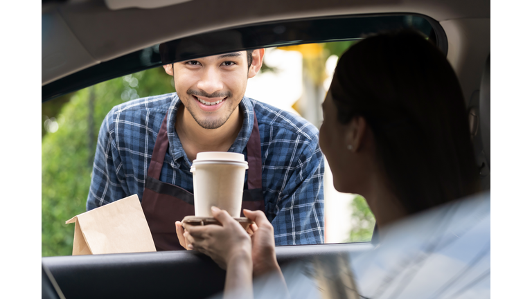 Waiter deliver food throght drive thru service