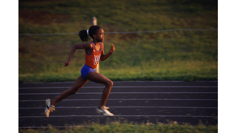 Girl Running on Track