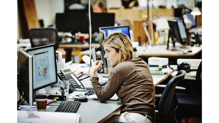 Female architect on the phone with client