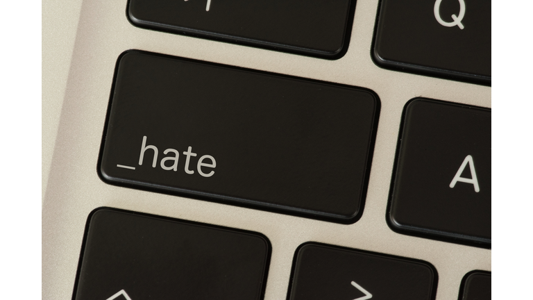 A computer and button for hate