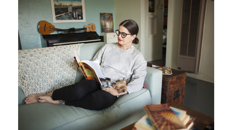 Woman on couch reading