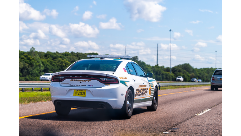 Florida highway road near Tampa with traffic sheriff police car
