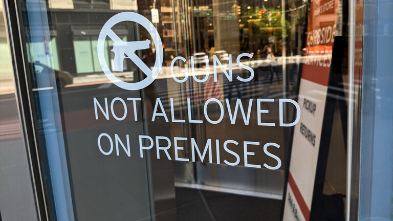 No Guns Allowed Sign at Retail Store
