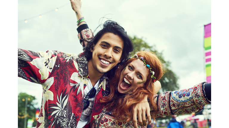 Group of friends having fun at a music festival