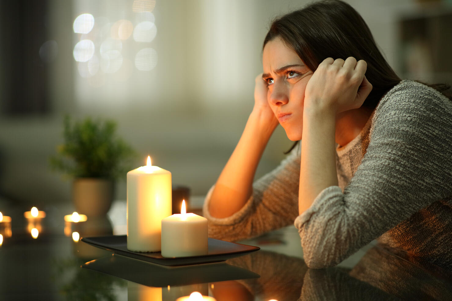 Angry homeowner using candles during power outage