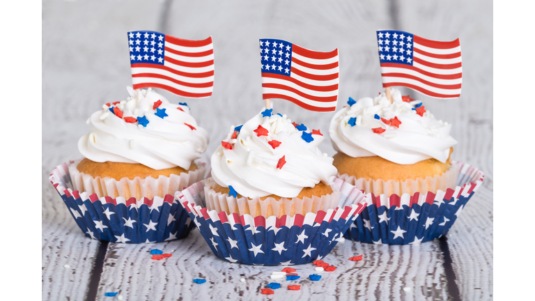 Patriotic cupcakes with sprinkles and American flags