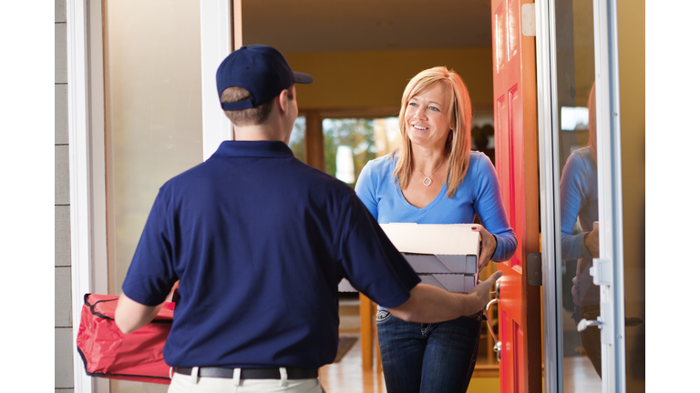 Take-out Pizza Delivery Man at Customer's Door