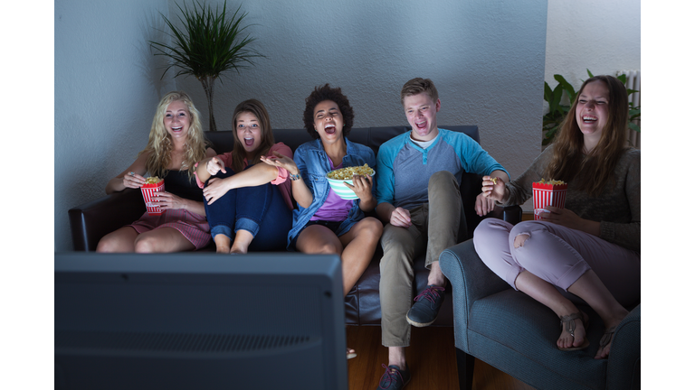 Teenager Group of Friends Watching Humorous Movie, TV Show Together