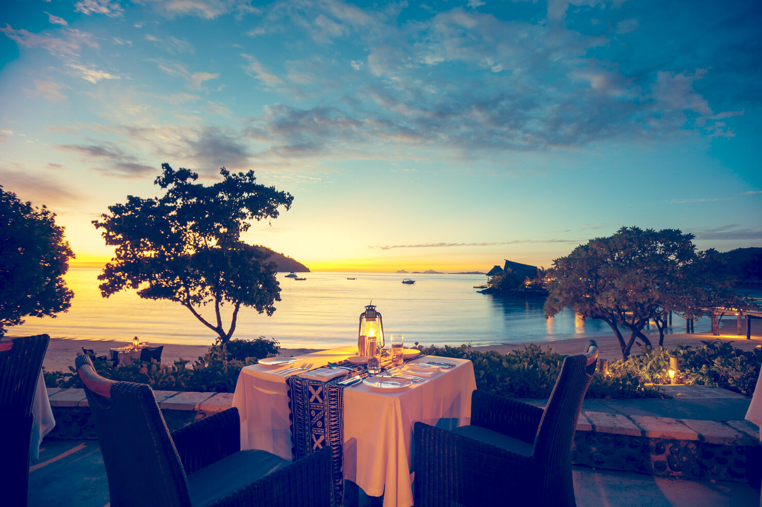 Romantic seaside restaurant at sunset
