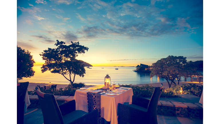Romantic seaside restaurant at sunset