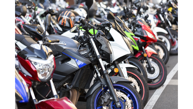 Parked motorcycles, background with copy space