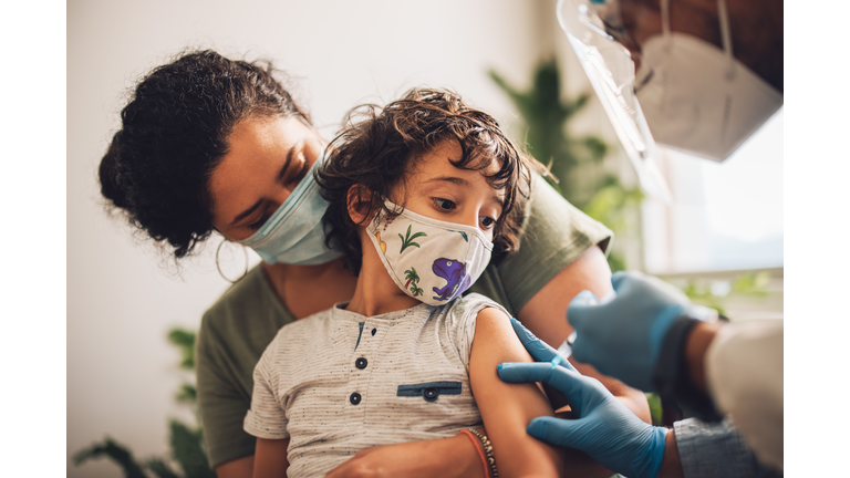 Kid receiving covid vaccine at home