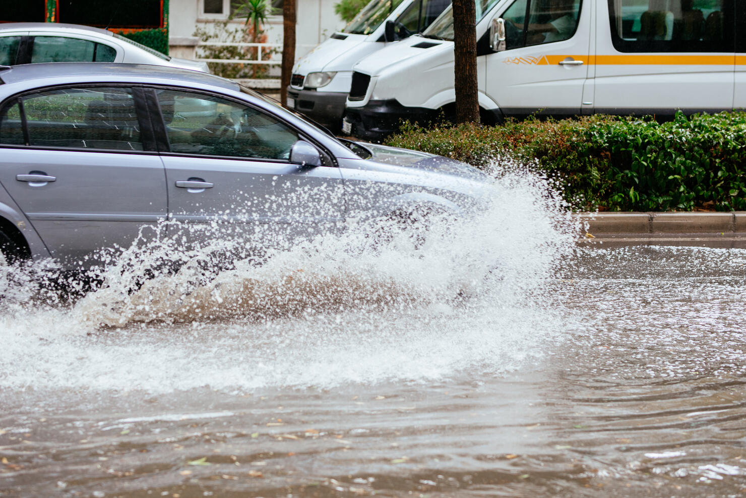 Motion Cars on a flooded city road at the rain day