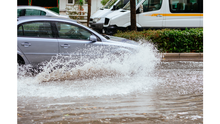 Motion Cars on a flooded city road at the rain day
