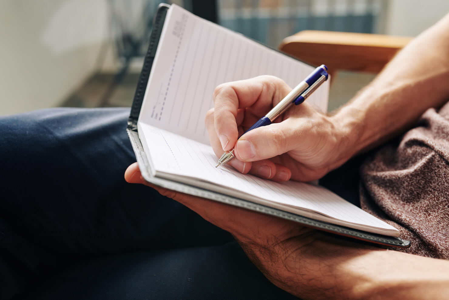 Man writing down thoughts