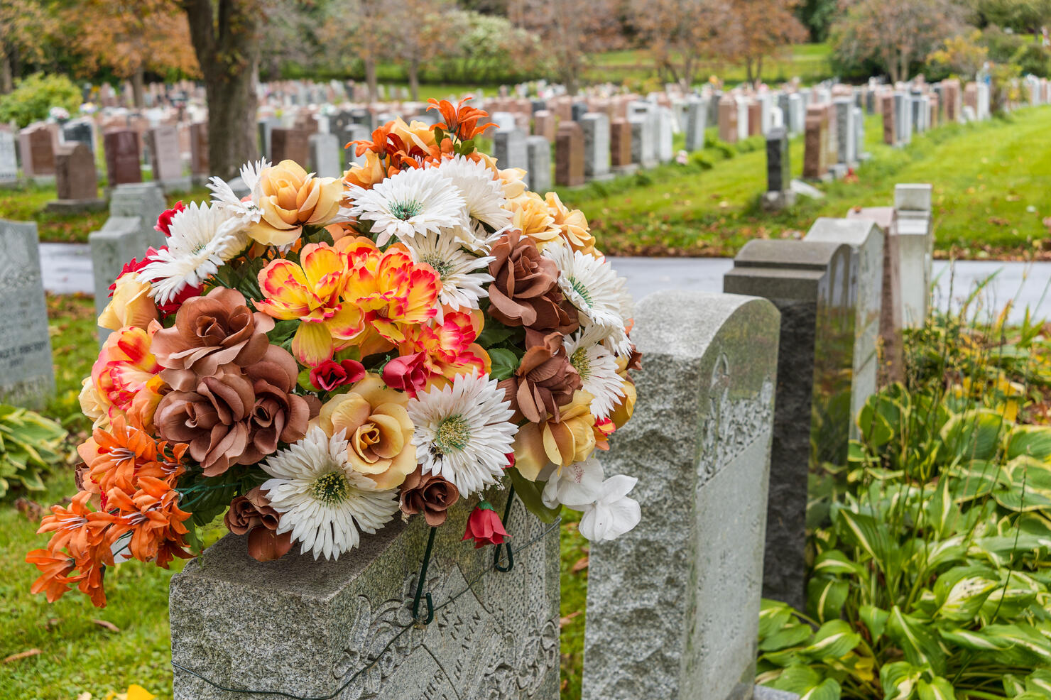 Flowers on a tombstone in a cemetary