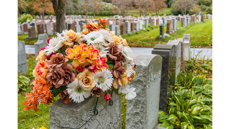 Flowers on a tombstone in a cemetary