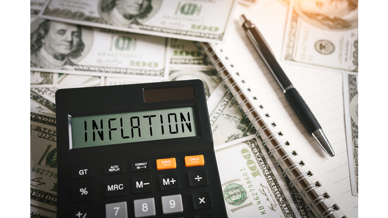 INFLATION word on calculator in idea for FED consider interest rate hike, world economics and inflation control, US dollar inflation