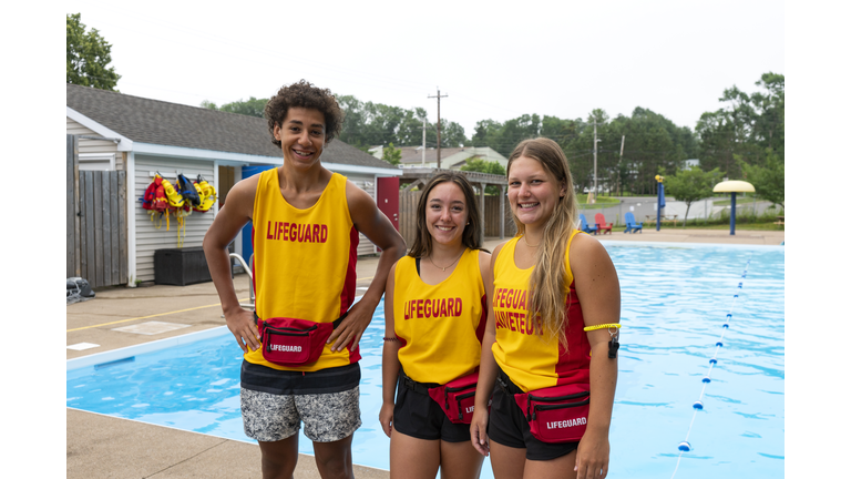 Happy teen lifeguards