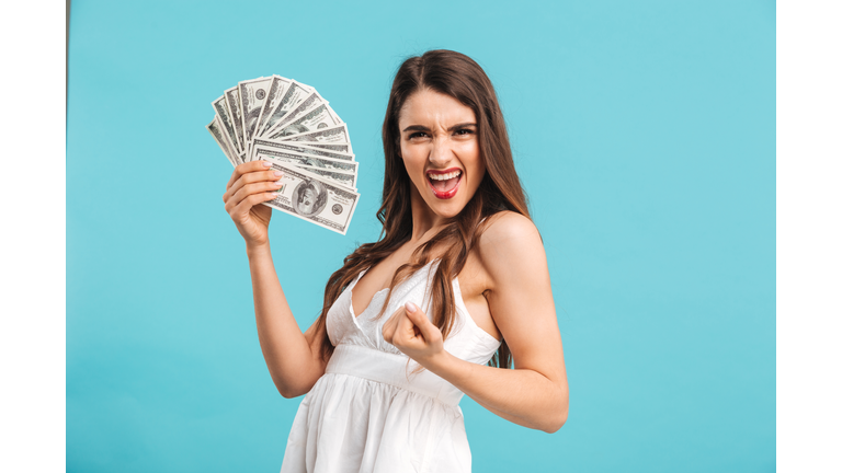 Portrait of a cheerful young girl in summer dress