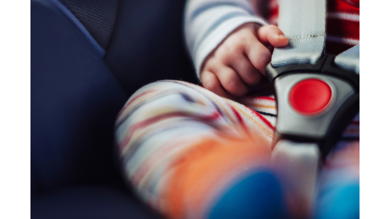 Baby in car seat.