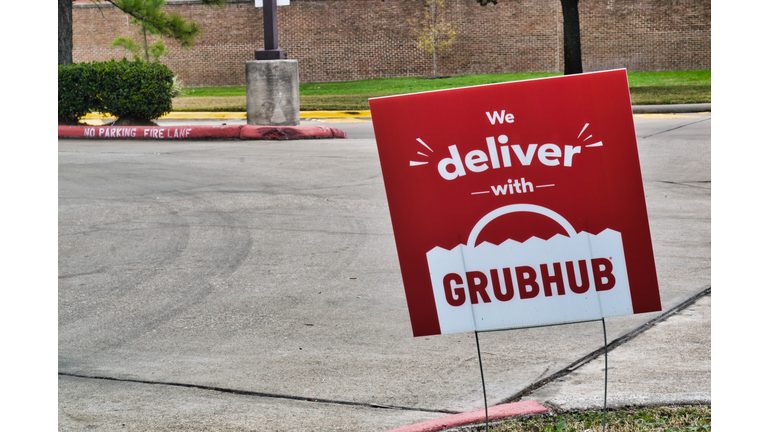 Grubhub sign posted in the ground in Humble, Texas.