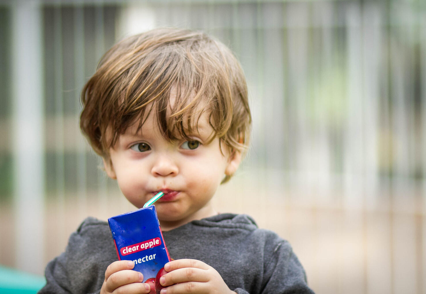 Young Boy Drinking a Juice Box