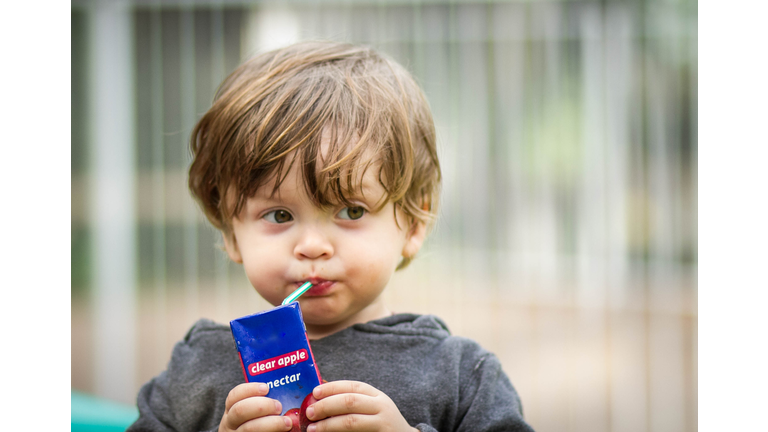 Young Boy Drinking a Juice Box