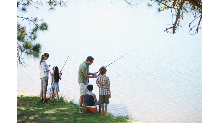Family fishing lakeside