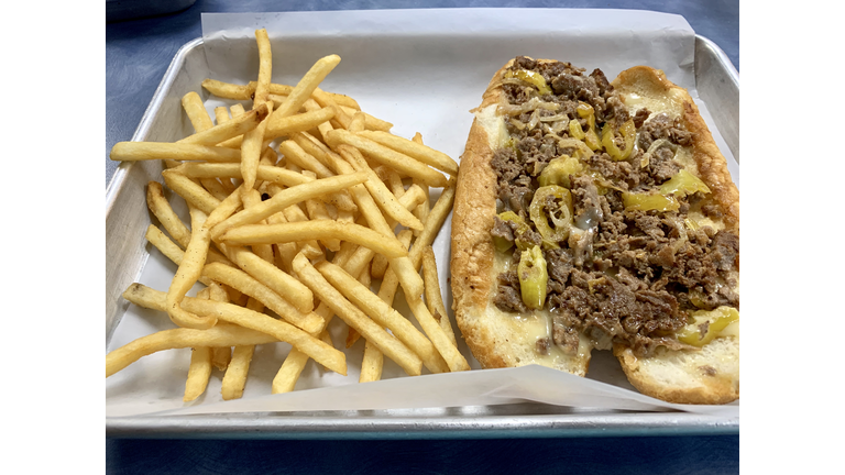 Philly cheesesteak and fresh fried potatoes