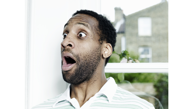 Portrait of man looking surprised