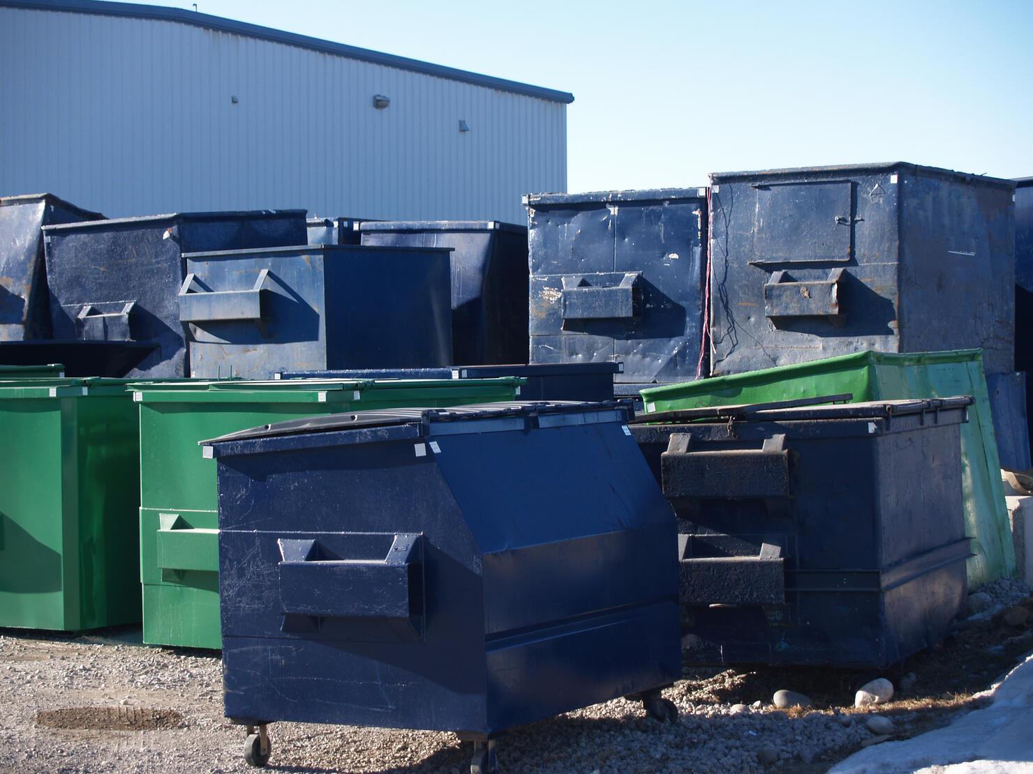 Many Garbage Dumpsters
