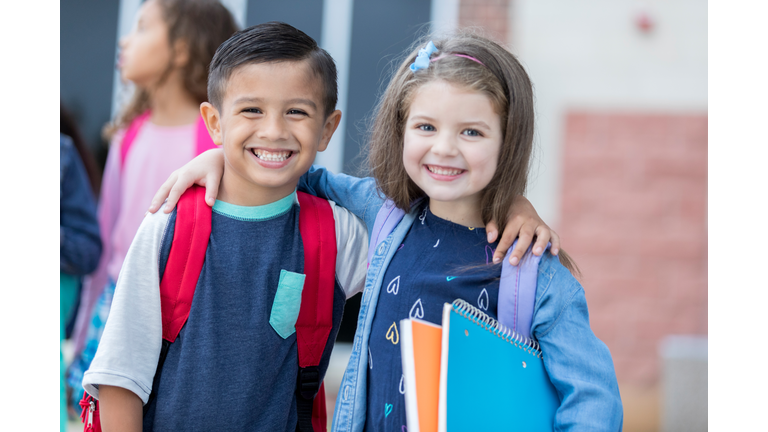 Adorable young school friends