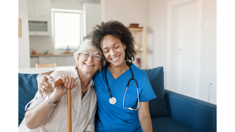 Portrait of Senior Woman and Her Mixed Race Female Caregiver