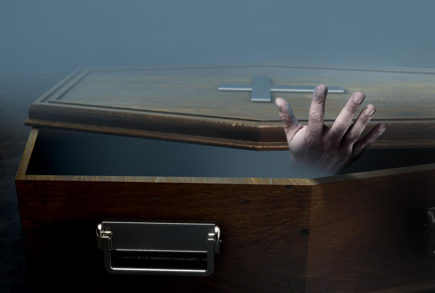 Open Coffin And Hand