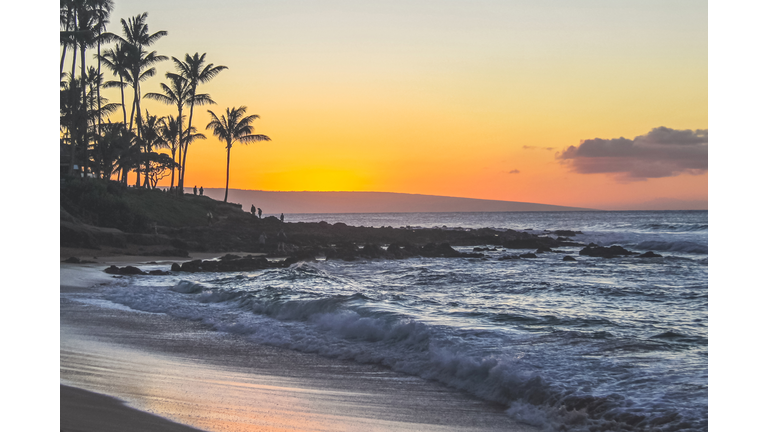 Scenic sunset view at Napili Bay Beach with ocean waves, Maui, Hawaii Islands