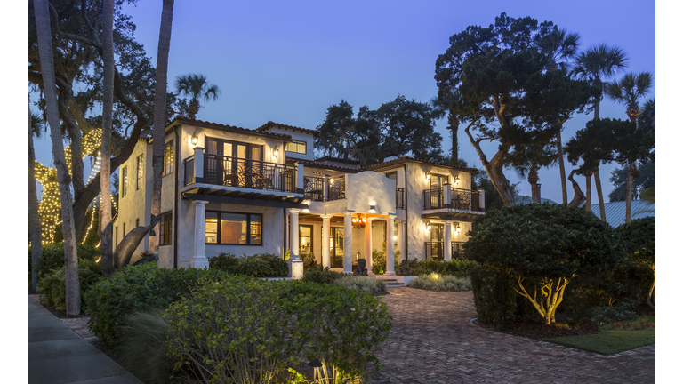 Mansion at Night Surrounded by Gardens in Florida