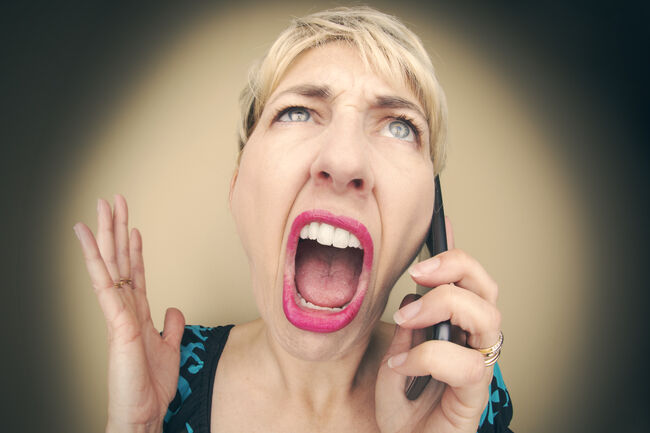 Angry Woman Raging on Cell Phone