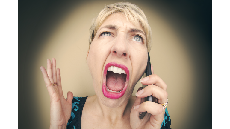Angry Woman Raging on Cell Phone