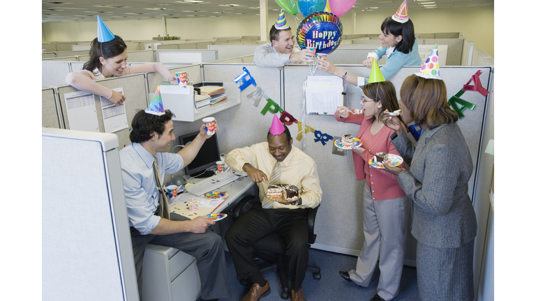 Office workers celebrating birthday party, elevated view