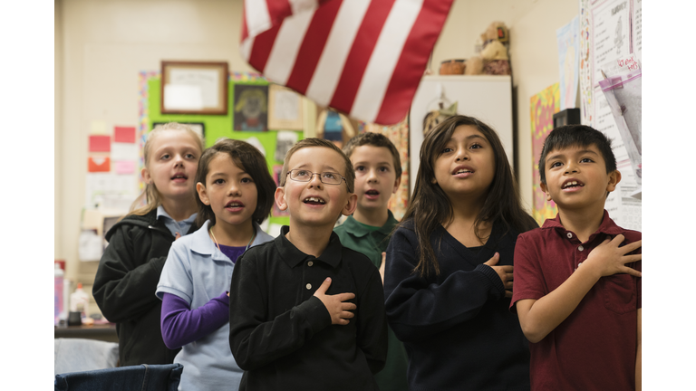 Students standing for Pledge of Allegiance